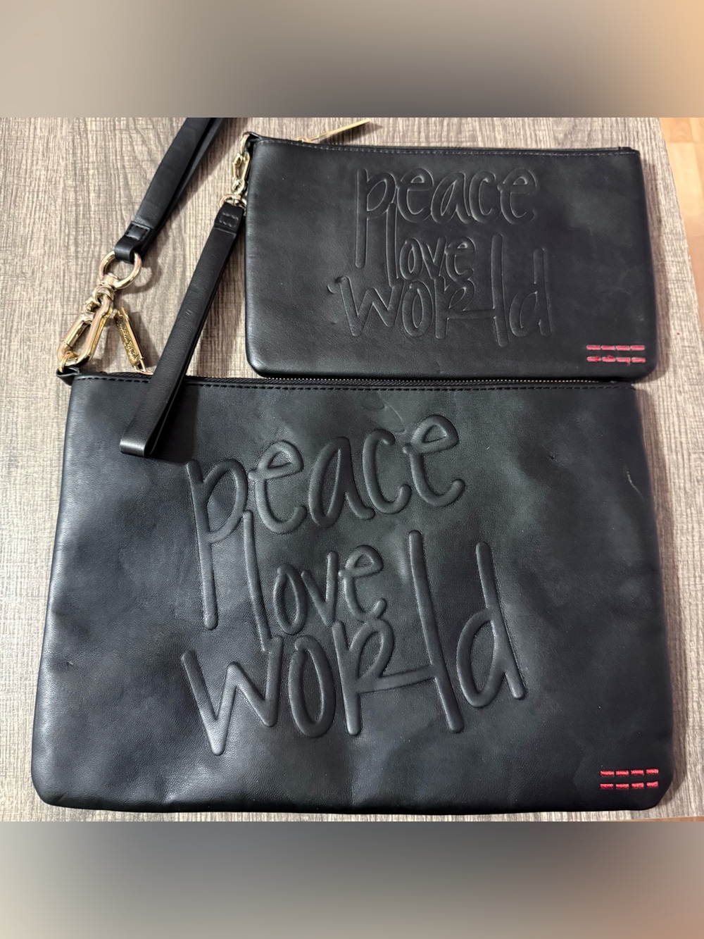 2 Peace Love World Black Embossed Leather Clutch Wristlets